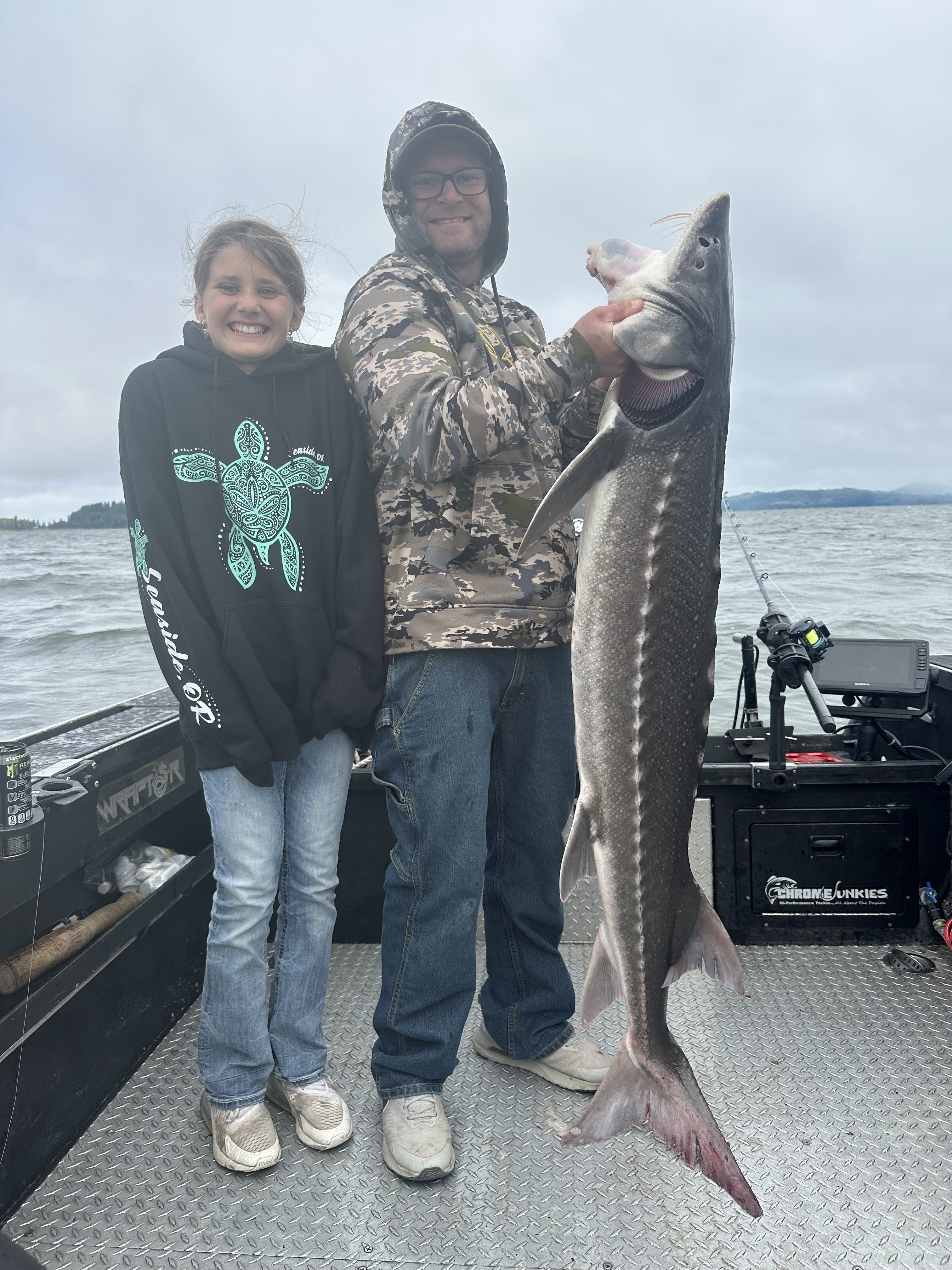 Young angler with a large sturgeon on a guided Lower Columbia River trip